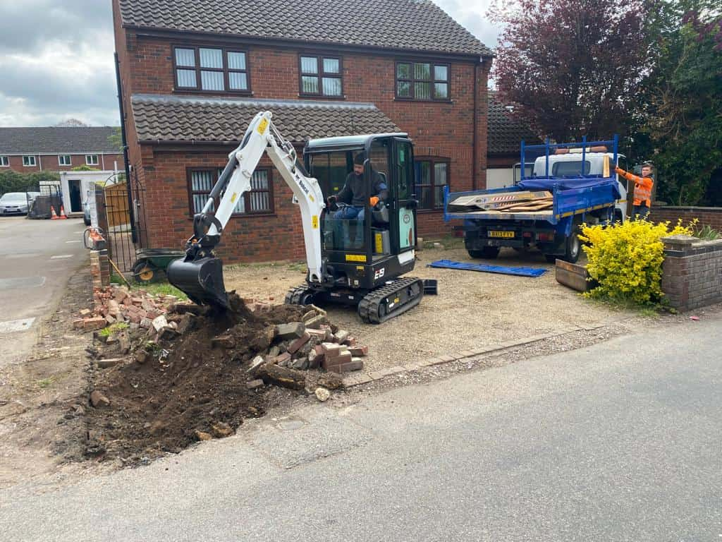 This is a photo of an operative of Hitchin Driveways Digging out for a new tarmac driveway